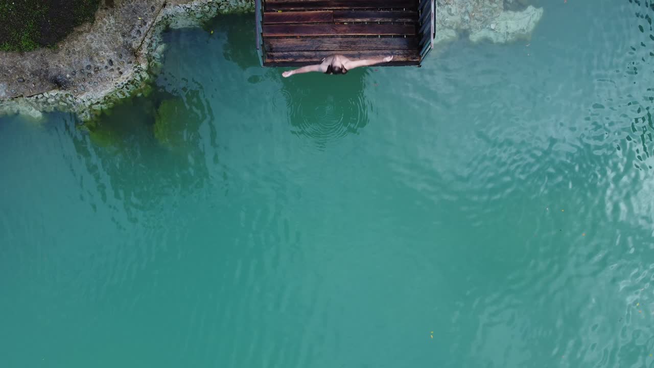 Backflip diving movement, adventure activity, tropical outdoor location