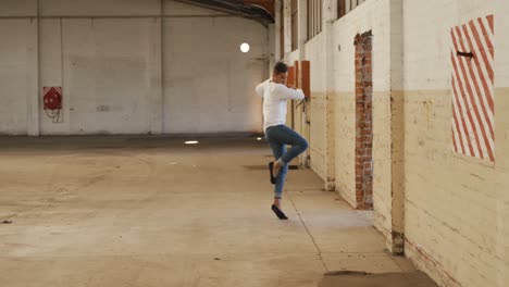 Male-dancer-in-an-empty-warehouse