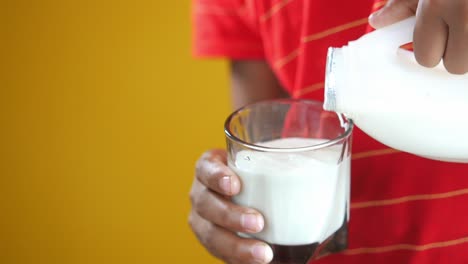 pouring milk into a glass