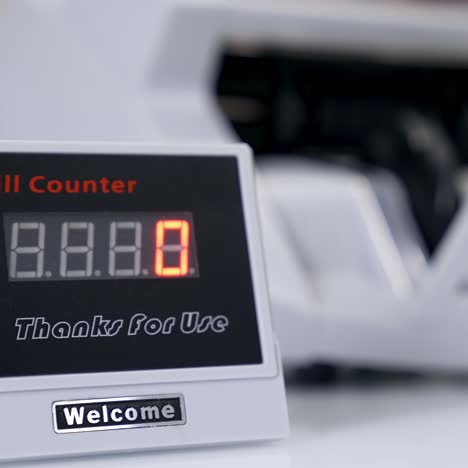 us dollar banknote in counting machine. automatic mechanism for bank financial operations