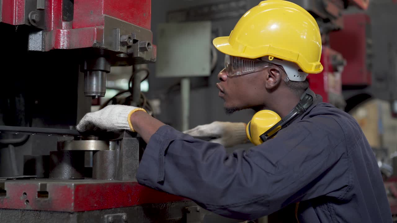 Engineers and skilled technicians are maintaining machinery. Engineers are working and repairing machines in industrial.