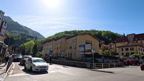 street view with pedestrians and cars in varenna