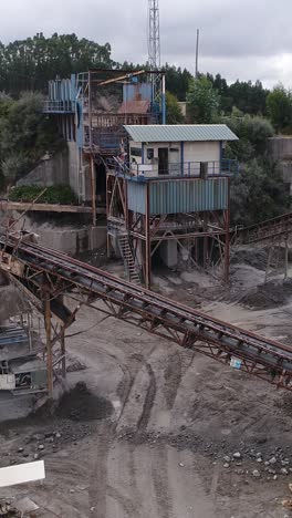industrial quarry site with conveyor belts and processing equipment