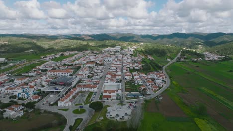 wide view drone flight over the beautiful aljezur city in portugal