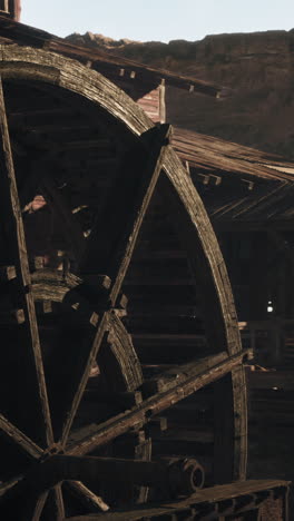 close-up of an old water wheel in a desert