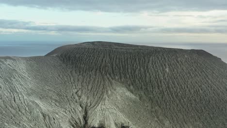 Aerial-view-of-Barcena-volcanic-rim-on-San-Benedicto-island,-Mexican-pacific