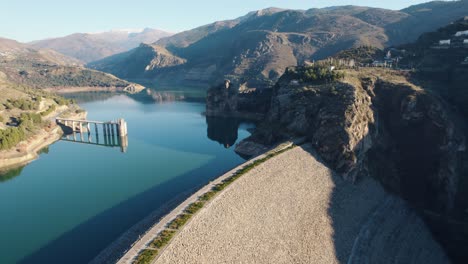 aerial view of the dam at embalse de canales in sierra nevada, spain