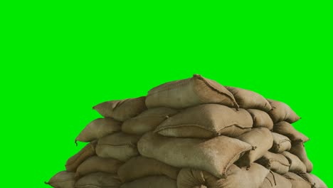 sandbags-for-flood-defense-or-military-use-on-green-chromakey-background