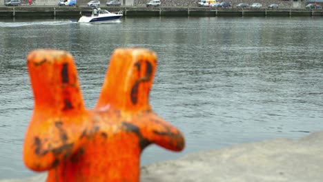 orange bollard on a dock