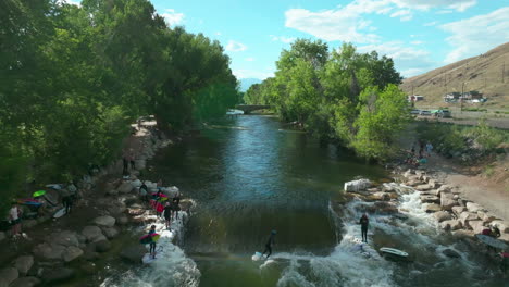 Salida-Colorado-aerial-cinematic-drone-river-surfing-scout-wave-summer-downtown-S-Lime-Mill-near-Buena-Vista-on-Arkansas-River-Riverside-Park-community-rafting-Rocky-Mountain-forward-slow-movement