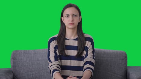 angry indian girl looking at the camera green screen