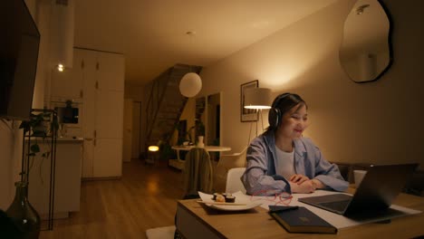 woman having a video call at home at night