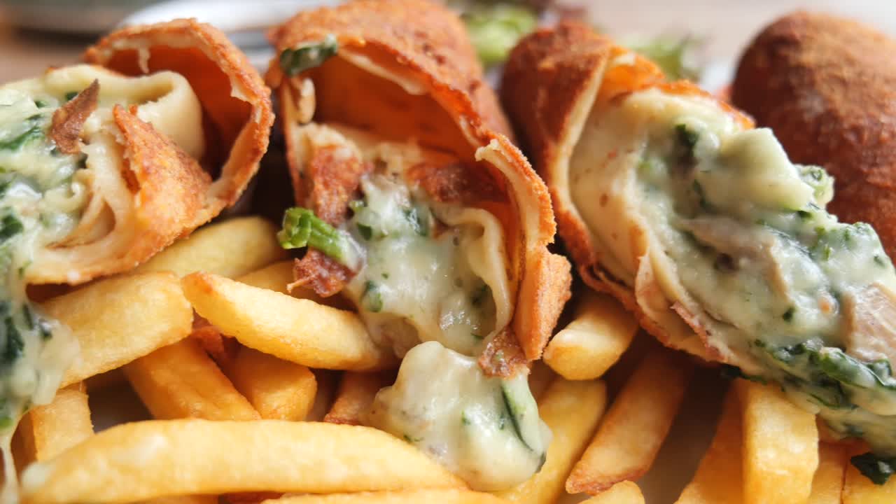 Fried Rolls with Creamy Cheese and Spinach Filling Served with French Fries