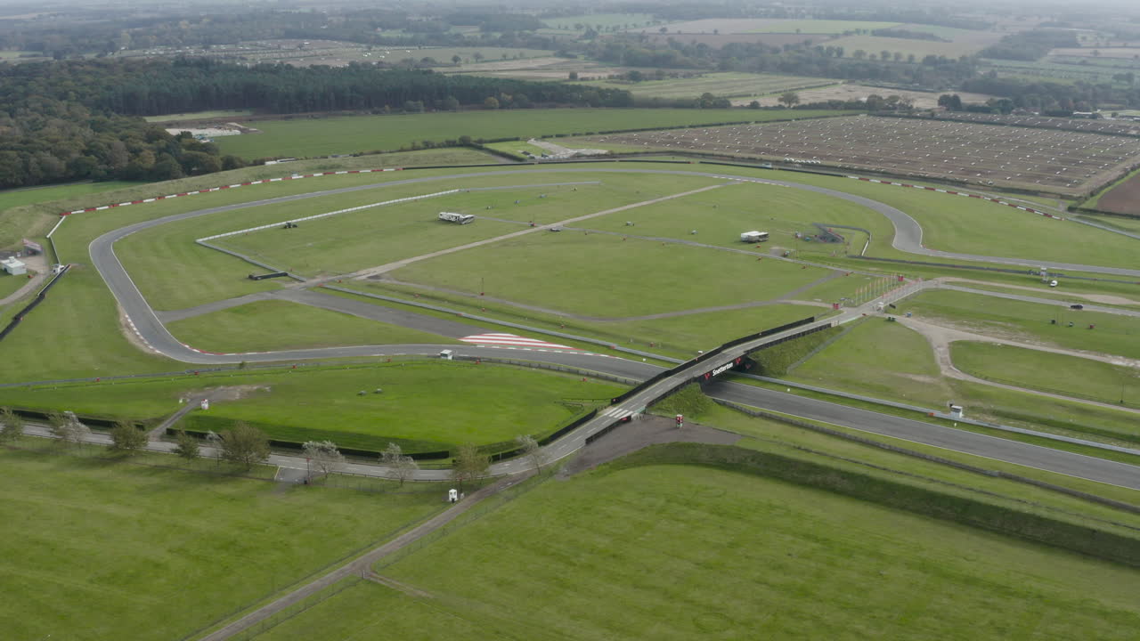 Race circuit in amongst green fields and trees in the countryside