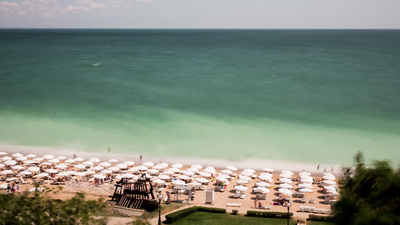 Aerial view timelapse of tourist on the beach