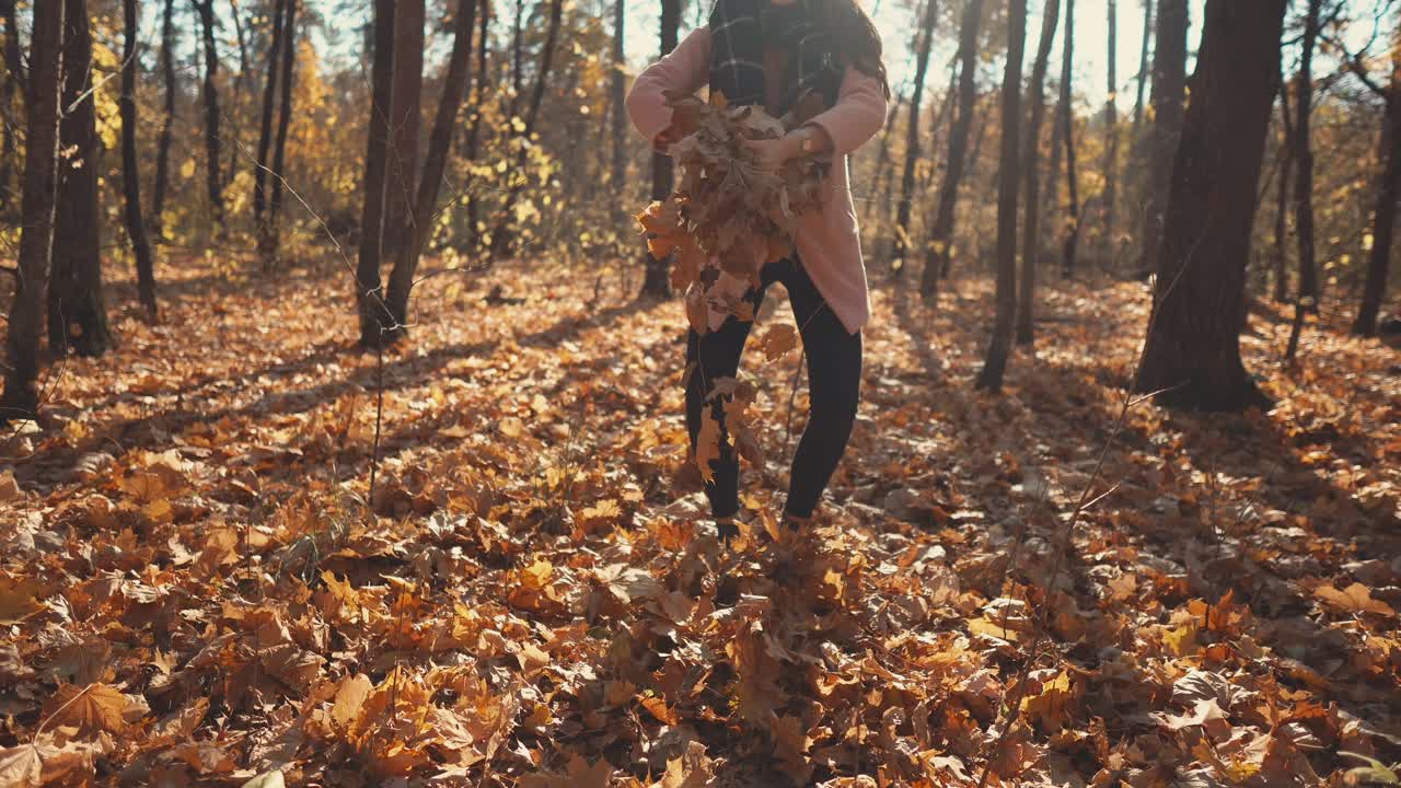 Woman enjoying a fall day in the forest
