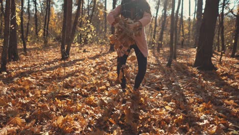 woman enjoying a fall day in the forest