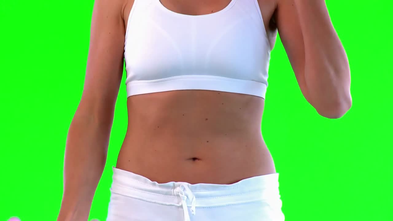 Athletic woman doing exercise with dumbells