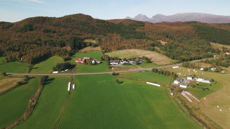 verdant farmlands in northern norway, drone dolly in shot