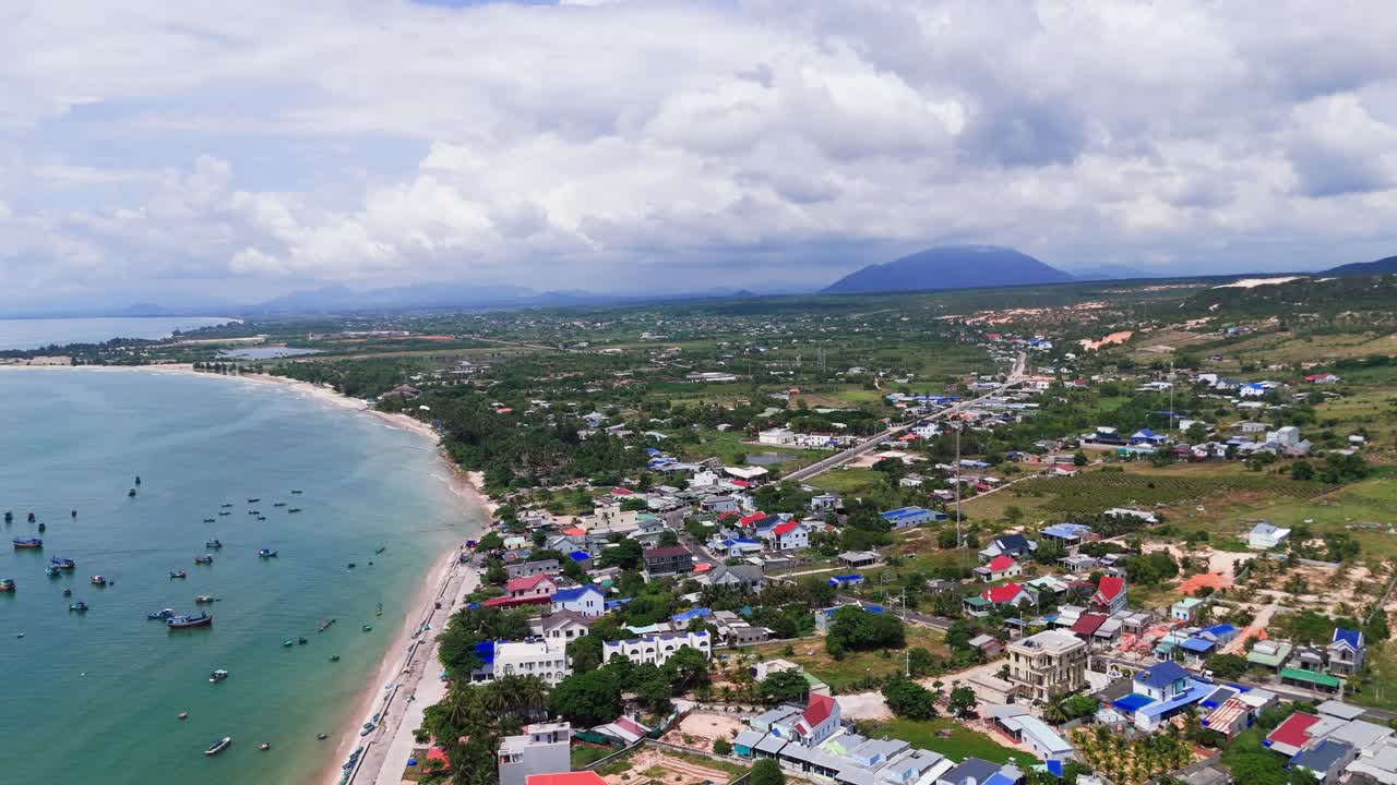 Aerial View Dolly of the Town Near the Coast in Binh Thuan (Vietnam) During the Rainy Season