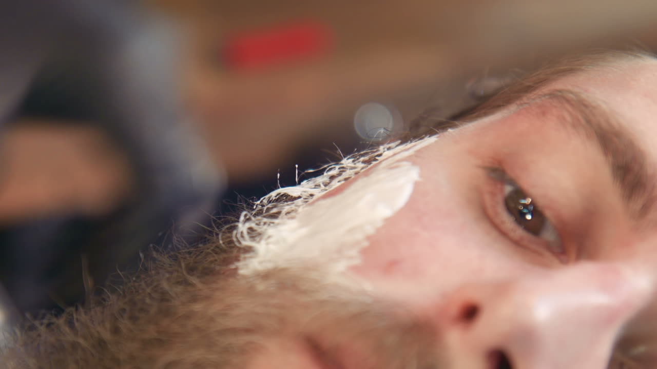 Barber Shaving a Man's Face