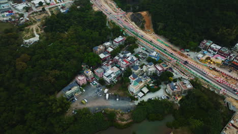 wonderful panning drone shot overlooking a small group of local houses