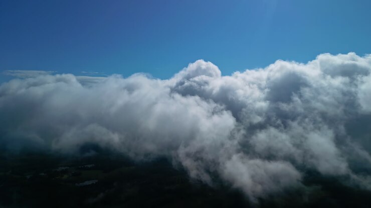 Flying at the altitude of clouds above the Earth - aerial