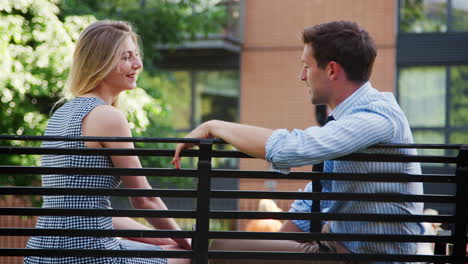 businessman talking to female colleague on break in park