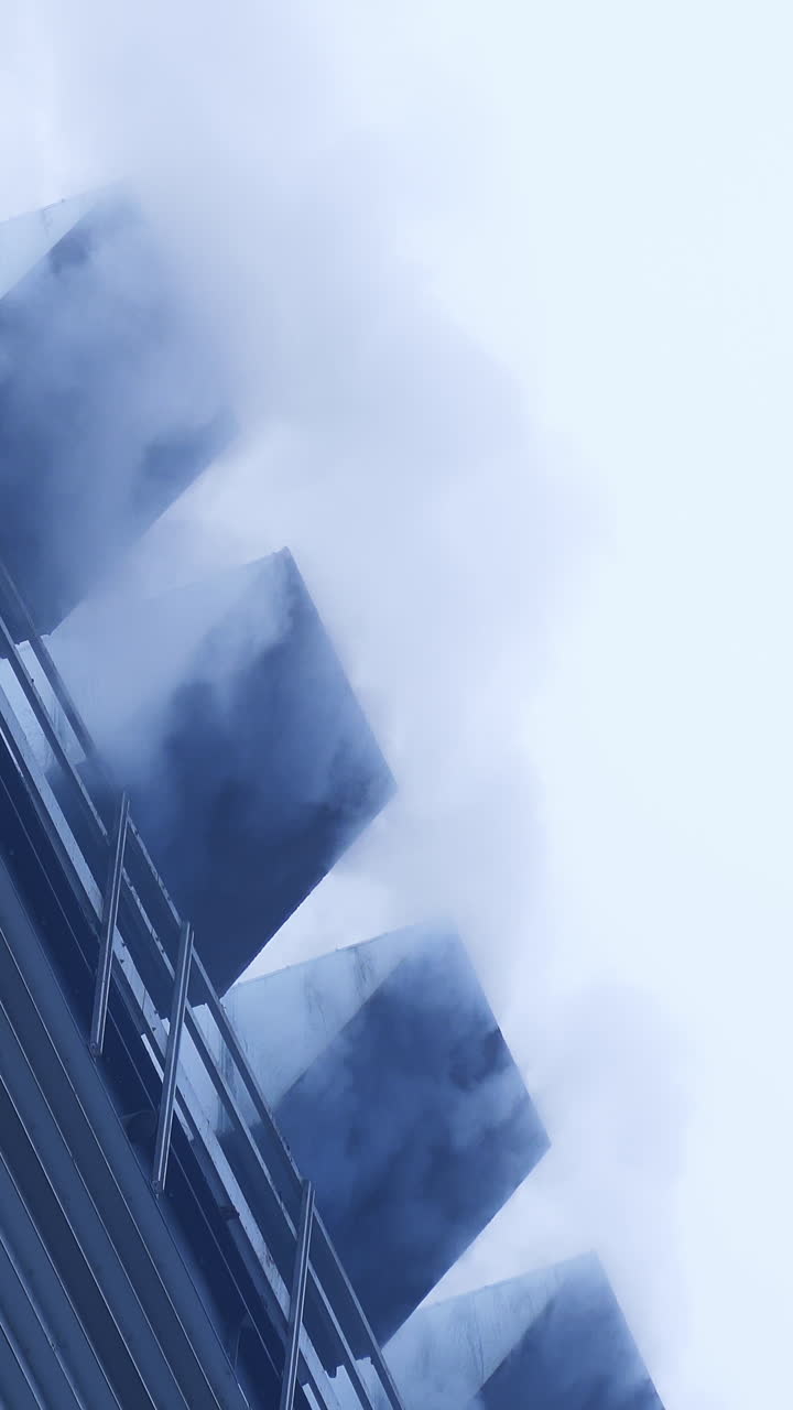Elevator heating system smoking. White puffs of smoke from a modern heating stove Vertical video