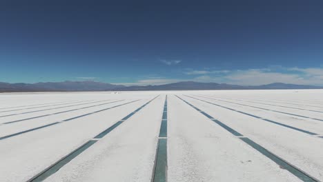 Aerial-view-over-water-stacks-in-natural-salt-flat-of-Salinas-Grandes,-Jujuy-Province,-Argentina