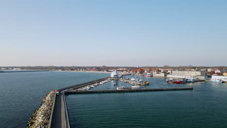 aerial view showing port of hel with docking boats and ships during sunny day with blue sky in poland