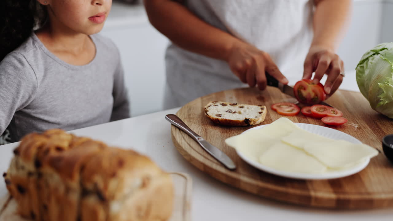 Mother and daughter making a sandwich