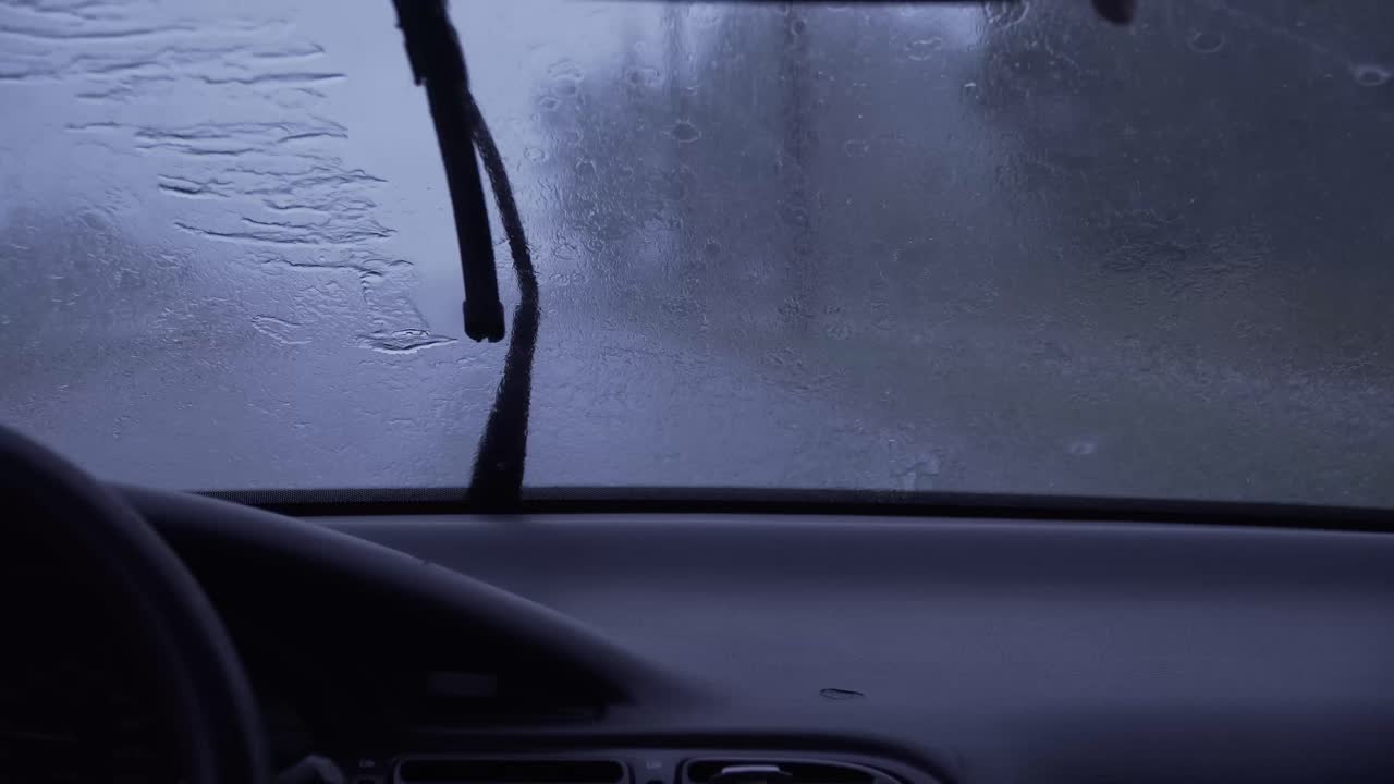 Car drive, passengers perspective, rainy day.