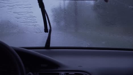 car drive, passengers perspective, rainy day.