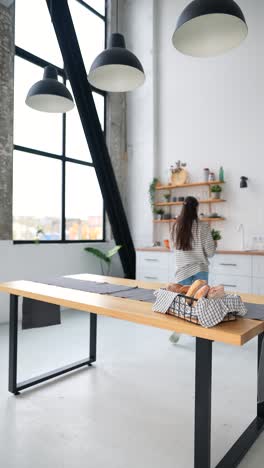 modern kitchen with woman and breakfast