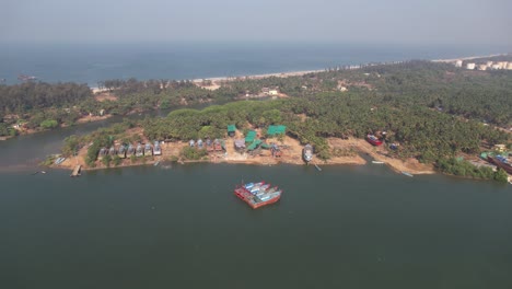 Drone-view-of-Boatyard-near-Tannirbhavi-Beach-located-Kasba-Bengre,-Mangaluru,-Karnataka-575010,-India
