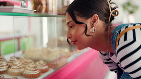 Bakery,-window-and-woman-with-choice-with-cake