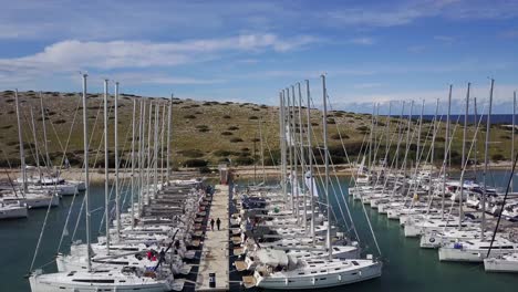 sailboats moored in marine piskera, kornati islands in croatia - aerial drone view
