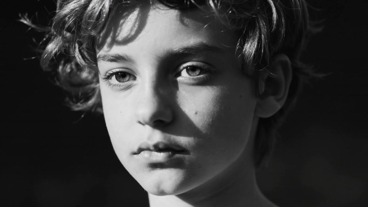Sunlight shifting, teen tilting head and blinking in studio for closer portrait showing face, hair