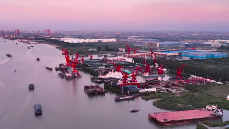 Drone-Shot-Container-Terminal-Port-Shipping-Industry-Facilities-With-Ships-And-Cranes,-Import-Export-Economy