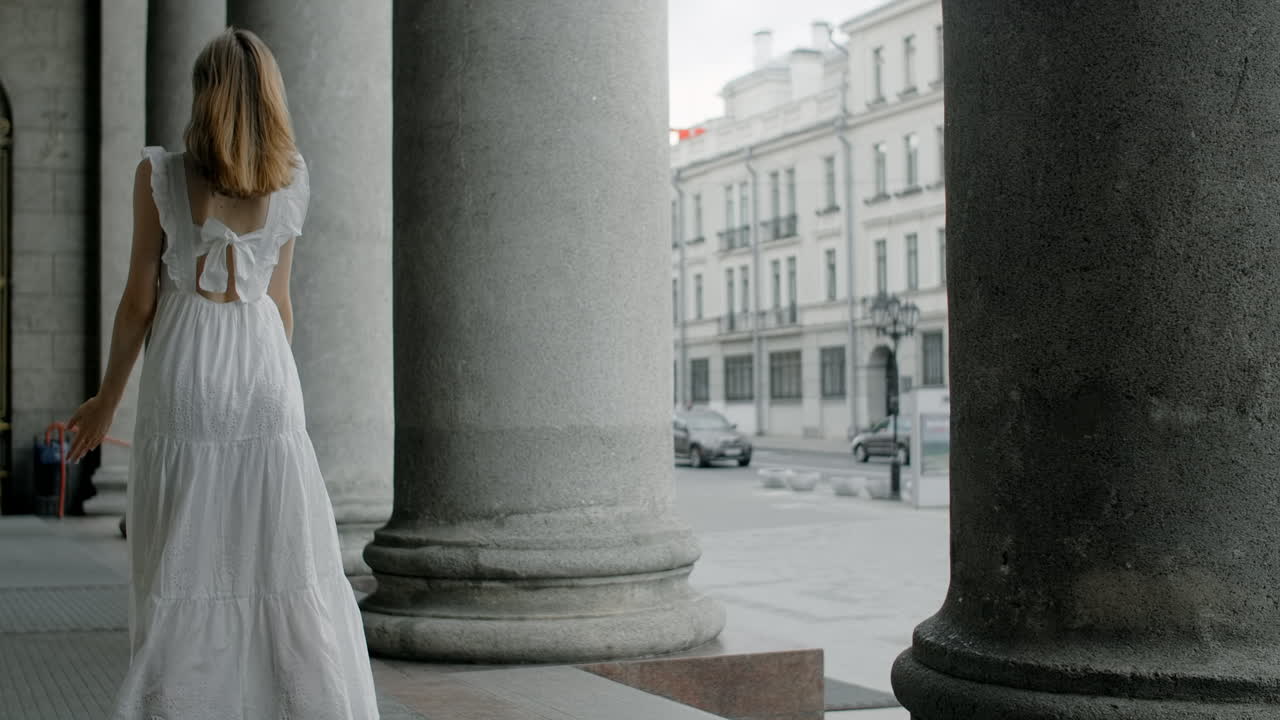 Woman Dancing in a White Dress
