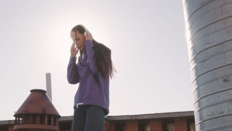 Brunette-woman-on-a-terrace-on-a-sunny-day