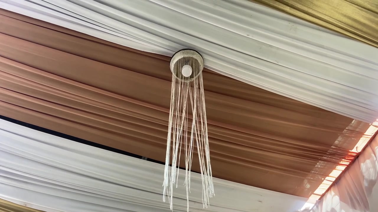 Elegant Draped Fabric Ceiling with Chandeliers and Modern Light Fixture