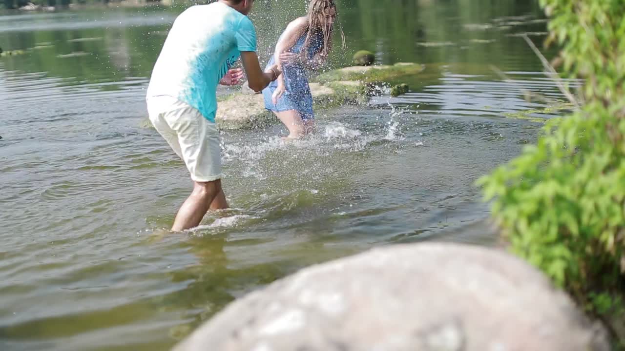 Couple Walking Near River. Happy couple walking near lake or river, having fun together