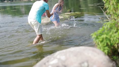 couple walking near river. happy couple walking near lake or river, having fun together