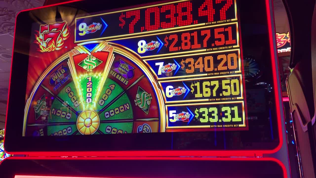 Close-up of a Quick Hit slot machine showing jackpot amounts and a ...