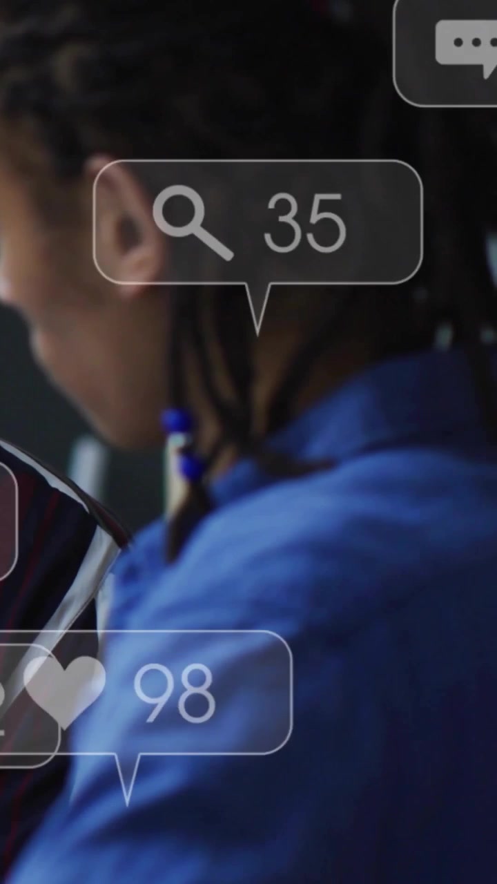 Vertical video: Man watching new social likes and comments piling then clearing tracking metrics