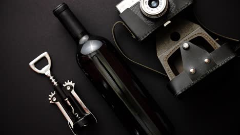 Red-wine-bottle--corkscrew-and-old-photo-camera