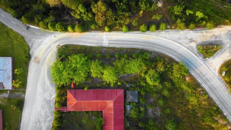 Amazing-cinematic-4K-residential-drone-footage-after-deforestation-issue-consists-of-many-homes,-road,-trees,-lake-and-infrastructure-in-the-middle-of-tropical-forest-located-in-Riau,-Indonesia