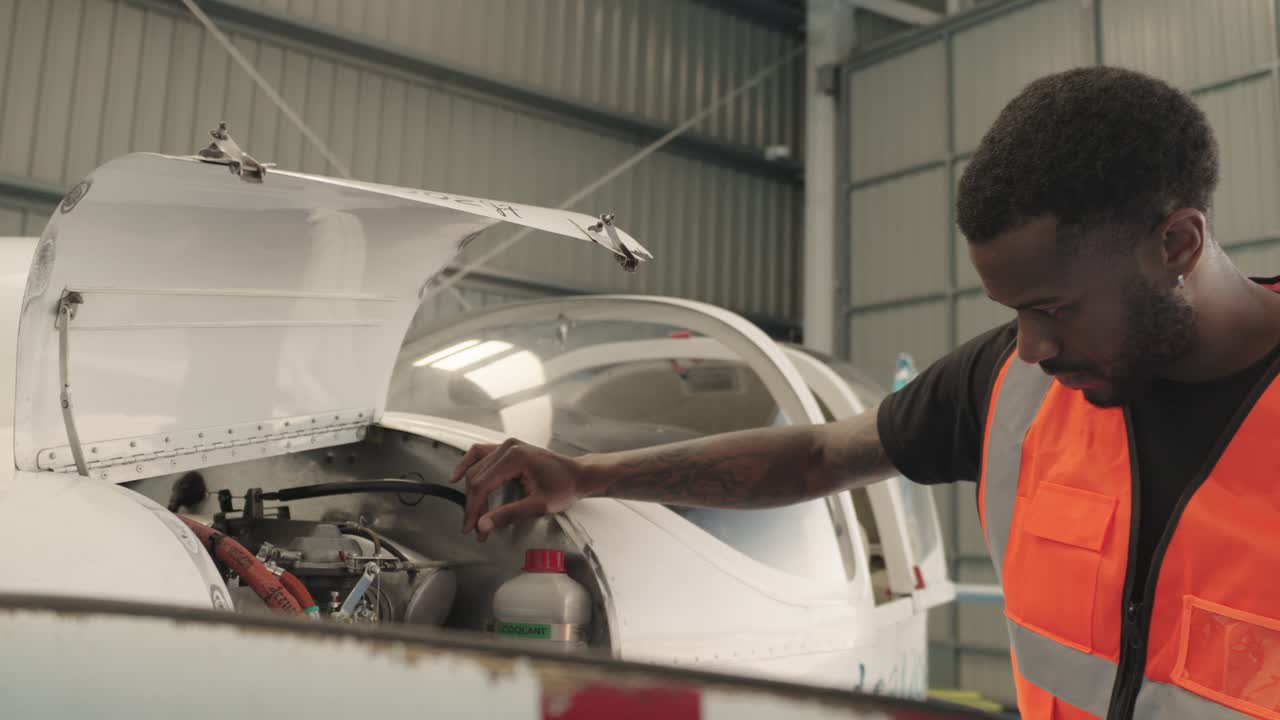 Aircraft Mechanic Performing Maintenance